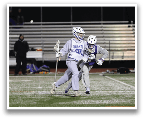 Two men playing hockey on a field, one with a blue helmet and the other with a white helmet. AI generated content