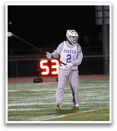 A man in a hockey uniform is holding a stick and walking on a field. AI generated content