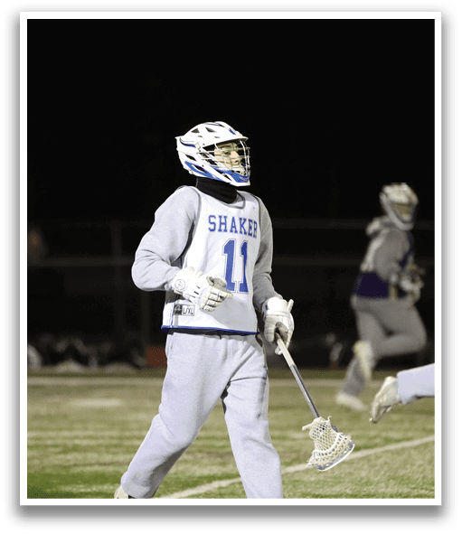 A group of lacrosse players running on a field. AI generated content