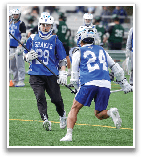 Two men playing lacrosse on a field. AI generated content