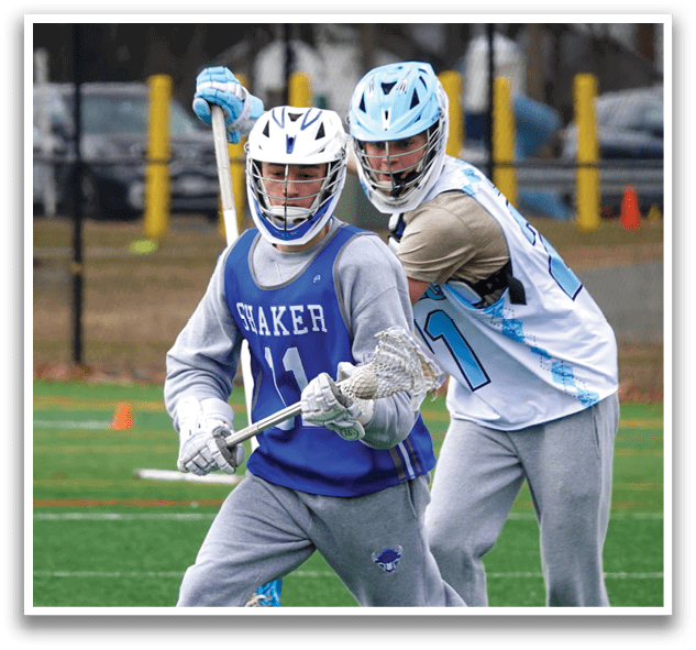 Two young men playing lacrosse on a field. AI generated content