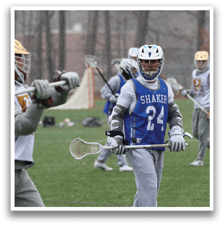 A group of people playing a game of lacrosse on a field. AI generated content