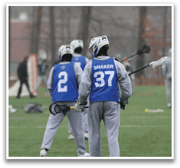 A group of people are standing on a field, some holding lacrosse sticks. AI generated content