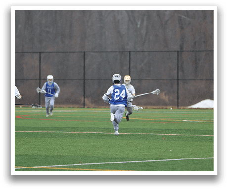 Three men are playing a game of lacrosse on a field. One of the players is wearing a blue and white uniform. AI generated content
