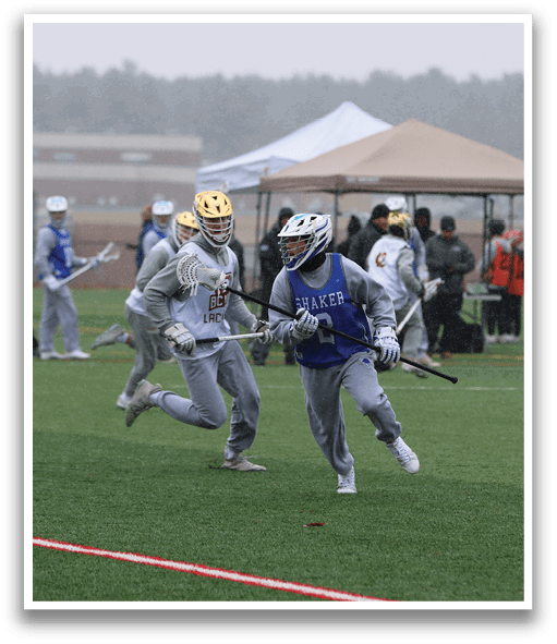 A group of people are playing a game of lacrosse on a field. AI generated content