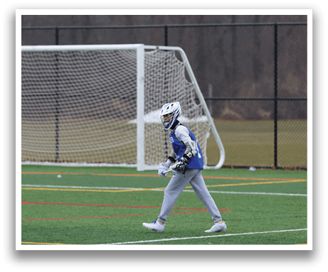 A person wearing a blue and white uniform is walking on a field. AI generated content