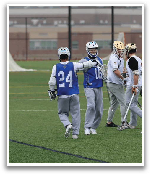 A group of lacrosse players on a field, some of them wearing helmets and holding sticks. AI generated content