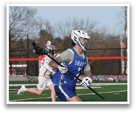 A man in a blue and white uniform is running on a field while holding a stick. AI generated content
