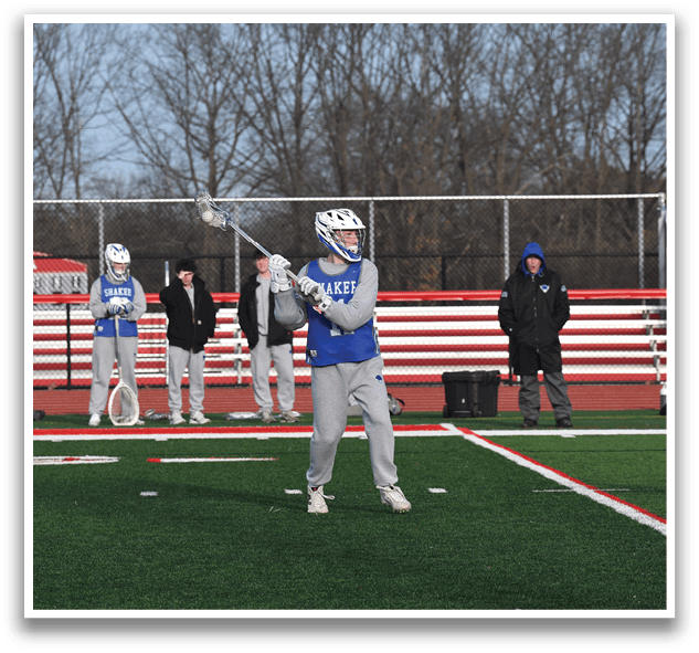 A group of people are playing a game of lacrosse on a field. AI generated content