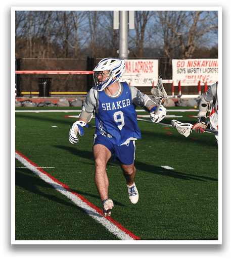 A group of people playing a game of lacrosse on a field. AI generated content