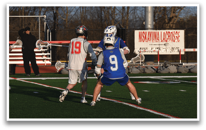 A group of young men playing a game of lacrosse on a field. AI generated content