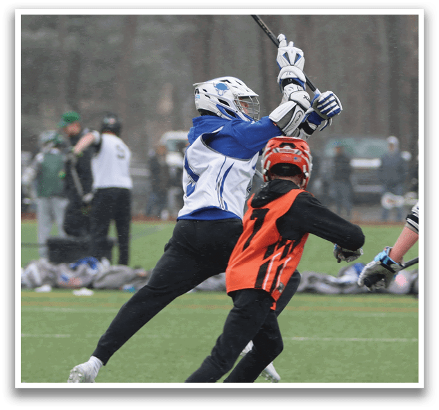 Two people playing lacrosse, one with a stick and the other trying to get past him. AI generated content