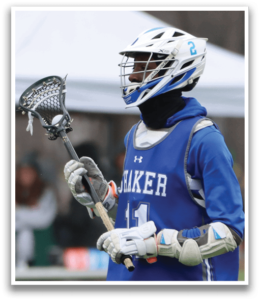 A man wearing a blue and white uniform holds a lacrosse stick. AI generated content