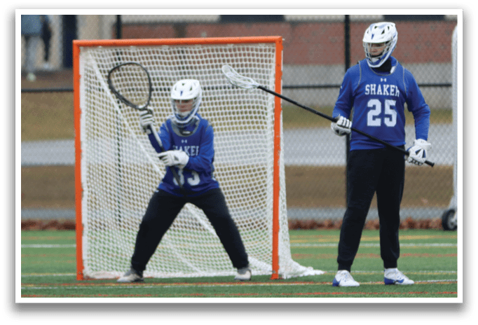 Two girls playing lacrosse, one holding a stick and the other with a net. AI generated content
