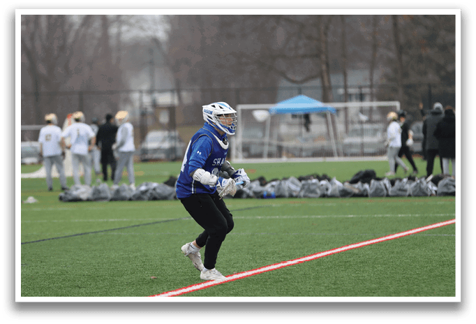 A person wearing a blue shirt and black pants is running on a field. AI generated content