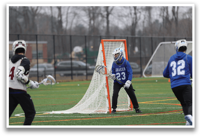 Three people playing a game of lacrosse. One person is holding a stick and is in front of a net. AI generated content