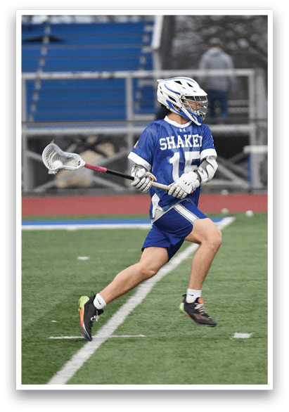 Two lacrosse players running on a field. AI generated content