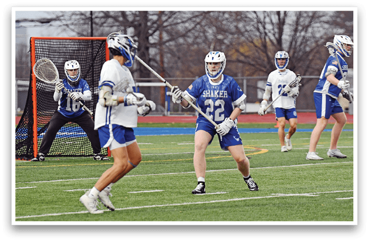 A group of people playing a game of lacrosse on a field. AI generated content