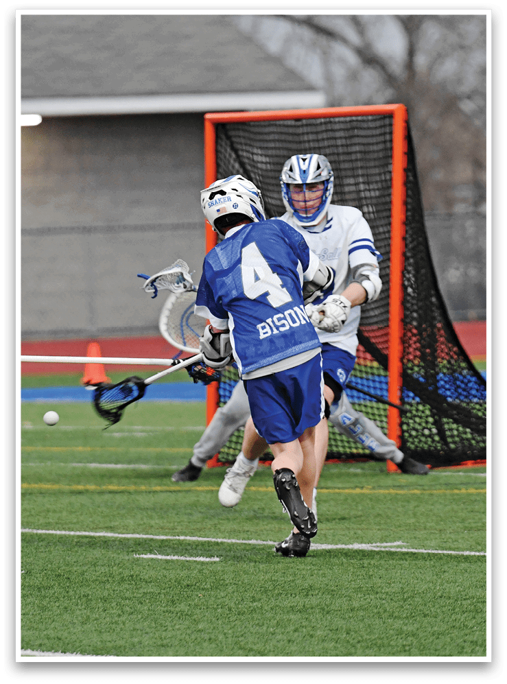 Two men playing a game of lacrosse, one is trying to score a goal while the other is trying to defend. AI generated content