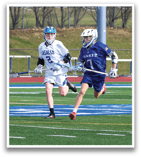 Two boys are playing lacrosse on a field. AI generated content