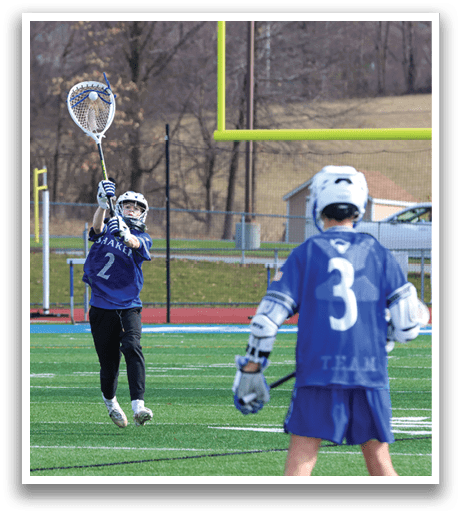 Two lacrosse players on a field, one holding a stick and the other wearing a helmet. AI generated content