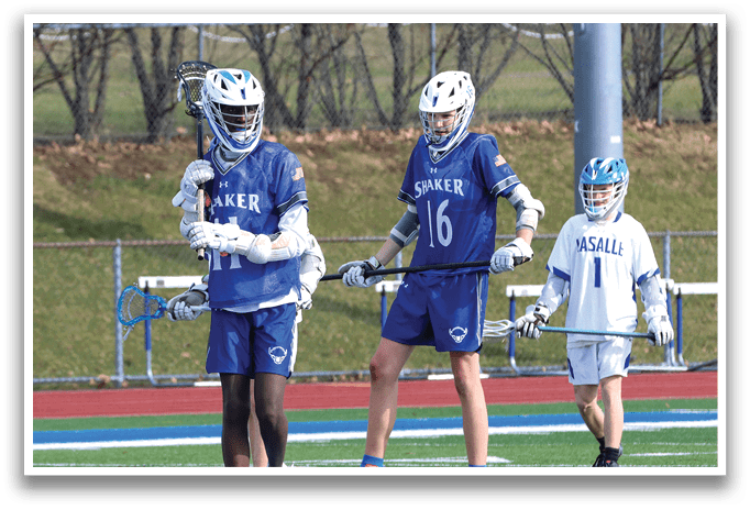 Three young men are playing lacrosse on a field. AI generated content