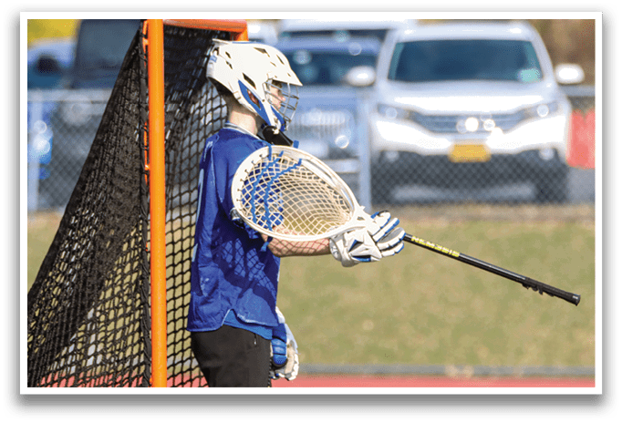 A person wearing a blue and white uniform is holding a baseball bat. AI generated content