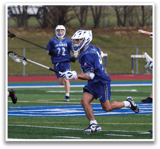 A group of young men playing lacrosse on a field. One player is running with a stick in his hand. AI generated content
