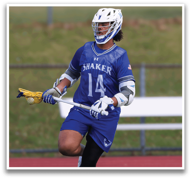 A man wearing a blue and white uniform is holding a lacrosse stick and running on a field. AI generated content