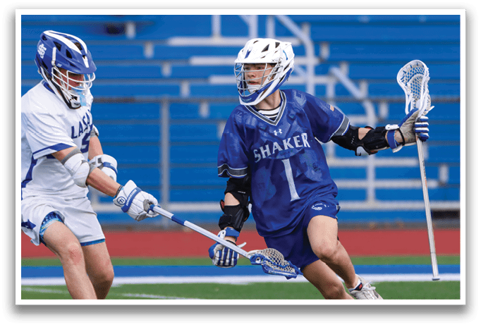 Two lacrosse players on a field, one with a blue uniform and the other with a white uniform. AI generated content