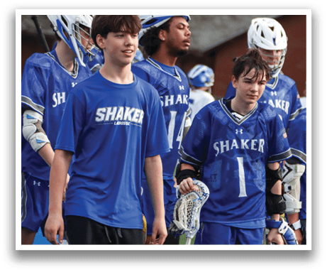 A group of young men wearing blue and white uniforms are standing on a field. AI generated content