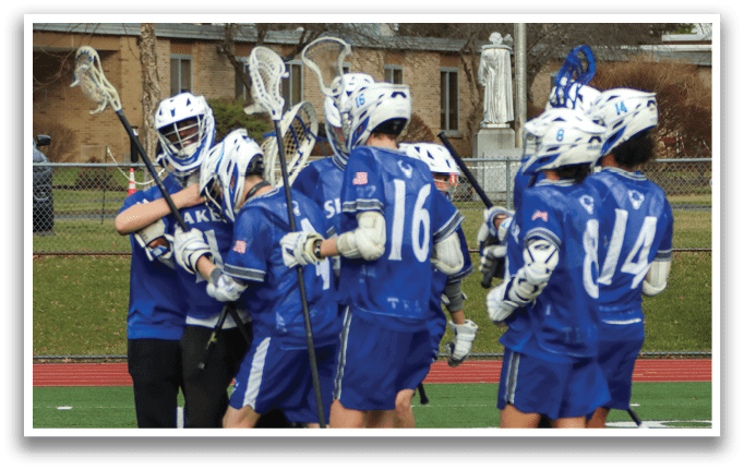 A group of lacrosse players hugging each other on a field. AI generated content