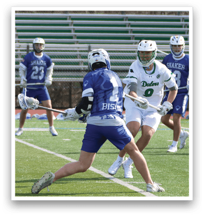 A group of people playing lacrosse on a field. One player is holding a stick and preparing to shoot the ball. AI generated content