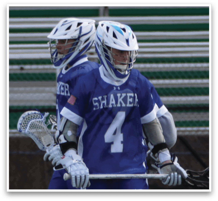 Two people playing lacrosse on a field. AI generated content