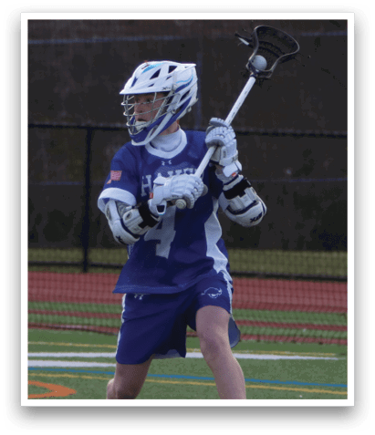 A young man wearing a blue and white uniform is holding a lacrosse stick and preparing to play. AI generated content