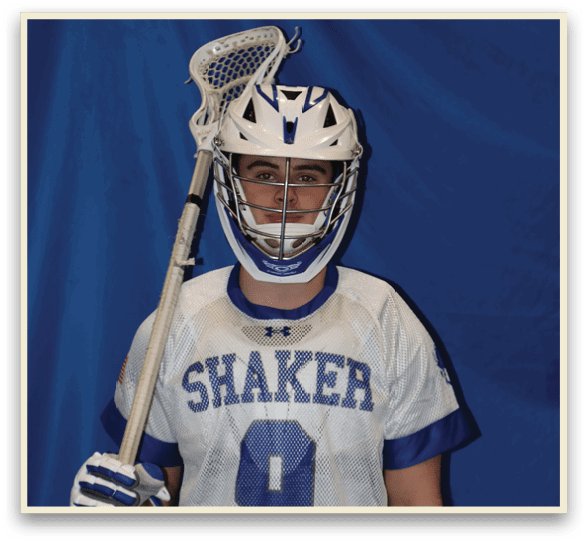 A young man wearing a Shaker lacrosse jersey holds a lacrosse stick. AI generated content