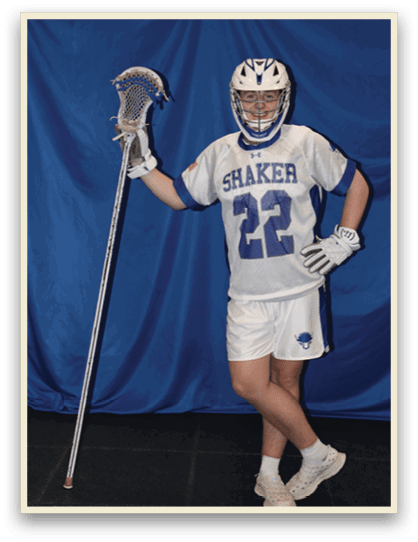 A man wearing a Shaker jersey holds a lacrosse stick. AI generated content