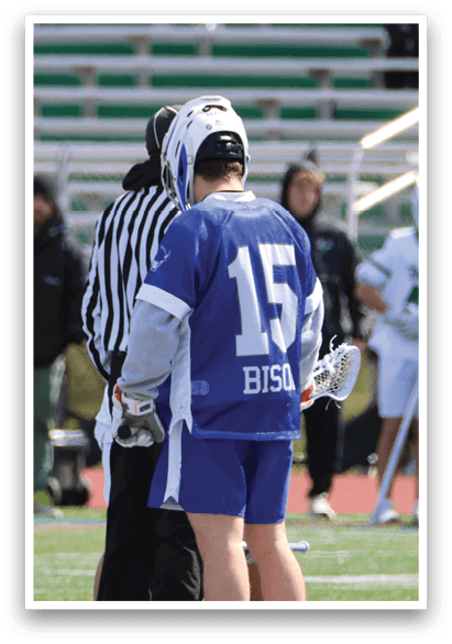 A group of people are standing on a field, with one person wearing a blue and white uniform. A referee is standing next to the player, and another person is holding a stick. AI generated content