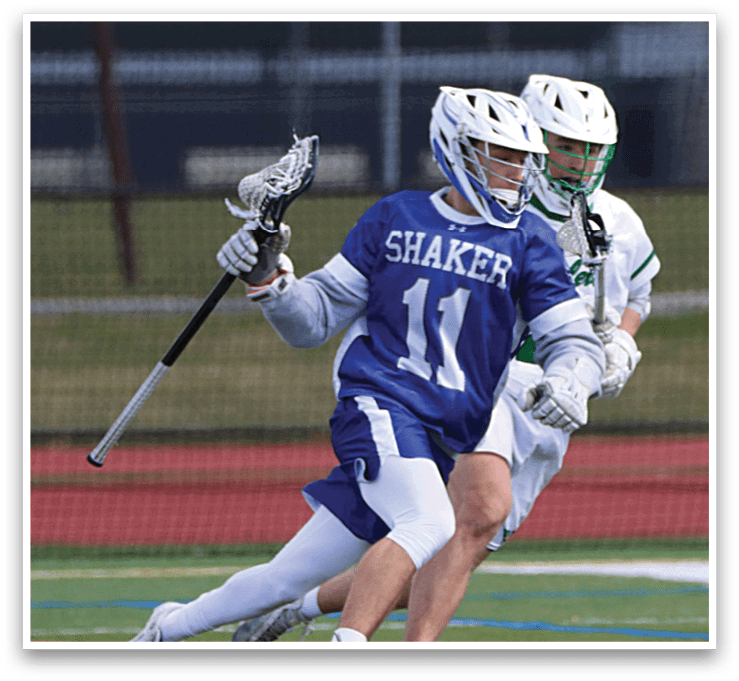 Two men playing lacrosse on a field. One man is running with a stick in his hand. AI generated content