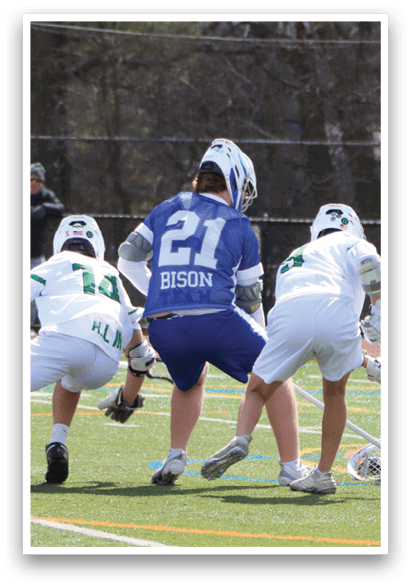 A group of men playing a game of lacrosse on a field. AI generated content