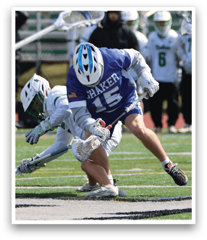 Two lacrosse players are on the field, one falling to the ground while the other is trying to catch the ball. AI generated content