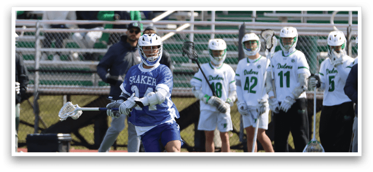 A lacrosse player in a blue and white uniform is running with a stick in his hand. AI generated content