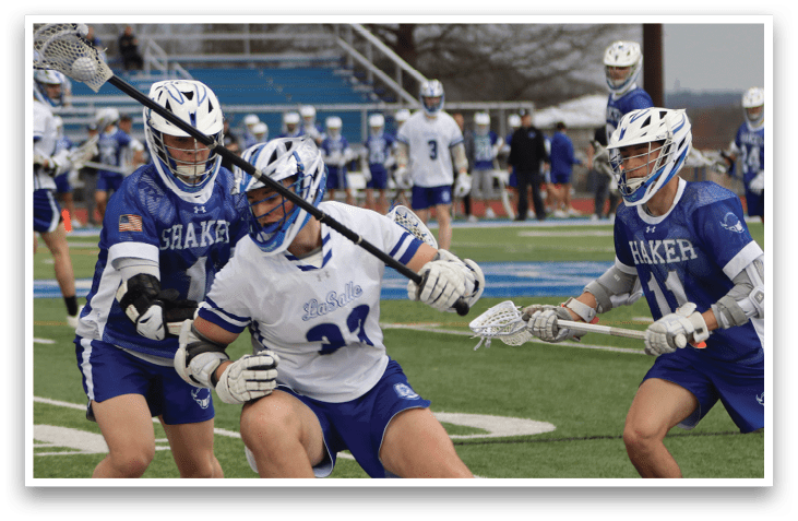 A group of men playing lacrosse on a field. One player is holding a stick and appears to be falling to the ground. AI generated content