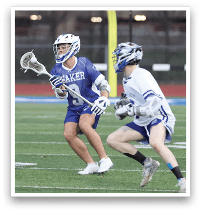 Two lacrosse players are running on a field, one wearing a blue uniform and the other wearing a white uniform. AI generated content