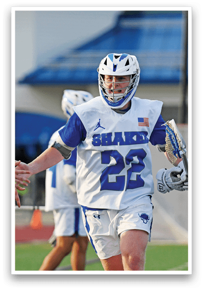 A man wearing a white and blue jersey with the number 23 on it. Description generated by AI
