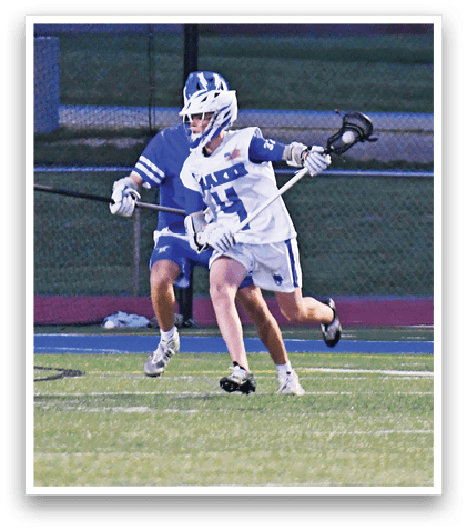 A man is running on a field with a blue and white uniform. Description generated by AI