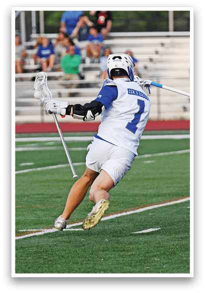 A man in a white jersey is running with a blue and white stick. Description generated by AI