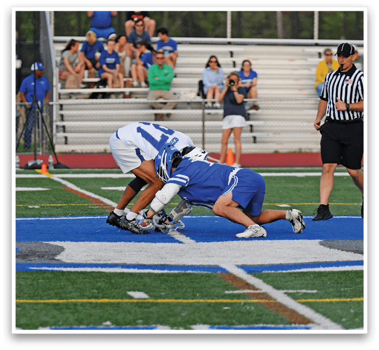 Two football players on the field. Description generated by AI