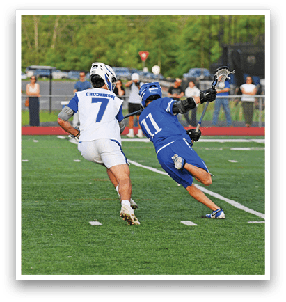 A man in a blue and white uniform is running on a field. Description generated by AI