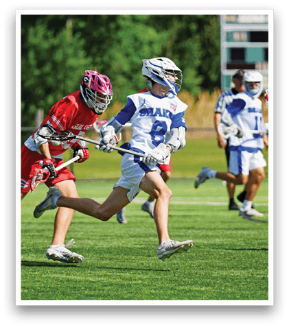 A group of people playing a game of lacrosse. Description generated by AI